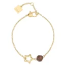 Bracciale THUN da donna in acciaio inossidabile color oro con charm a forma di stella vuota e perla di cristallo marrone scuro, su sfondo bianco.