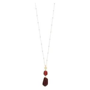 Collana lunga THUN da donna in acciaio inossidabile color oro con due pendenti in ceramica rossa irregolari e un quadrifoglio dorato.