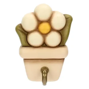 Portastrofinaccio THUN in ceramica color crema a forma di vaso stilizzato, decorato con un fiore bianco e foglie verdi, con un gancio metallico dorato alla base.