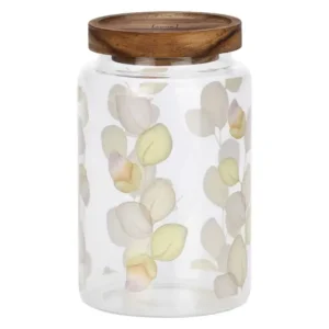 Barattolo grande in vetro trasparente THUN Country Bloom con coperchio in legno e decorazione di foglie di eucalipto in tonalità pastello.